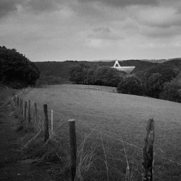 Radio Telescope Effelsberg.  The Radio Telescope Effelsberg is one of the largest fully steerable radio telescopes on earth. It is located in the Eifel, a low mountain range in western Germany, in a valley location between the surrounding mountains to protect the telescope as far as possible from radiation from civilization-related radio sources.