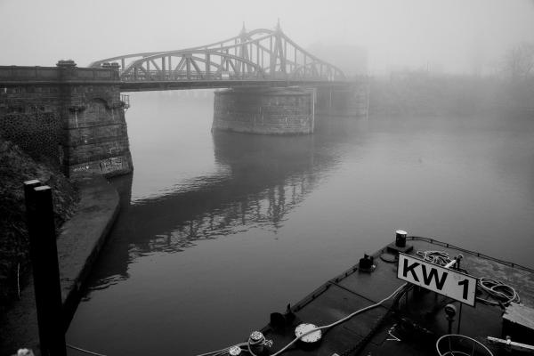 The historic swing bridge from 1905 in the Rhine port of Krefeld-Linn on a foggy day, still in operation after more than 100 years.